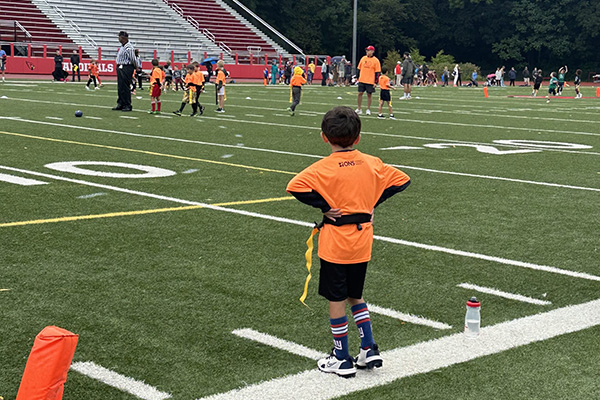Kid on sidelines of soccer game
